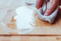 Applying wood care oil on a food board