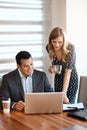 He appreciates her input. two young businesspeople working together in a modern office. Royalty Free Stock Photo