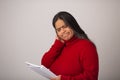 Apprehensive Hispanic Woman Looks Through Notes