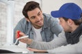 apprentice assembling stool under supervision Royalty Free Stock Photo