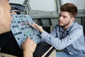 Apprentice being taught controls machine