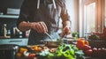 apprentice chef carefully preparing a dish in a bustling restaurant kitchen Royalty Free Stock Photo
