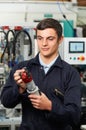 Apprentice Engineer Checking Component In Factory Royalty Free Stock Photo