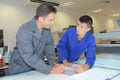 Apprentice and instructor in discussion Royalty Free Stock Photo