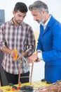Apprentice learning to cut copper pipe Royalty Free Stock Photo