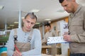 Apprentice learning to draw in workshop