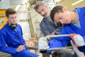 Apprentice learning to use bow saw