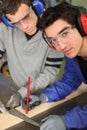 Apprentice marking wood