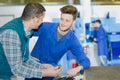 apprentice mechanic working in auto repair shop