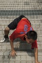 Apprentice monks train on steep steps in in Kaohsiung City, Taiwan