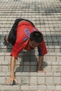 Apprentice monks train on steep steps in in Kaohsiung City, Taiwan
