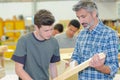 apprentice- teacher - carpentry class Royalty Free Stock Photo