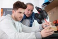 apprentice and teacher in carpentry workshop Royalty Free Stock Photo