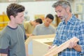 apprentice and teacher - carpentry workshop Royalty Free Stock Photo