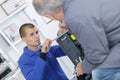 Apprentice technician working on appliance