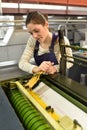 Apprentice woman in printshop Royalty Free Stock Photo