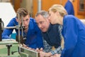 apprentices learning how to use machine Royalty Free Stock Photo