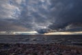 Approach of thunderstorm cloud at sunset. Royalty Free Stock Photo