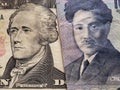 approach to American banknote of ten  dollars and Japanese banknote of 1000 yen Royalty Free Stock Photo
