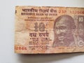 approach to Indian banknote of ten rupees