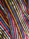 approach to a multicolored mexican rebozo with stripes, background and texture