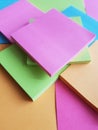 approach to paper notebooks for notes stacked in phosphorescent colors, background and texture