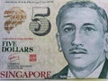 approach to singaporean banknote of five dollars, background and texture Royalty Free Stock Photo