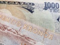 approach to swedish banknote of fifty kronor and Japanese banknote of 1000 yen Royalty Free Stock Photo