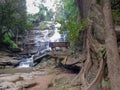 Approaching a hidden waterfall in a forest in northern Thailand