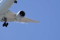 Approaching plane against a blue sky