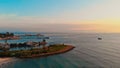 Approaching shot of mesmerizing seascape, pier and islands at sunset. Aerial view of sailing boats and gentle bewitching