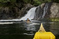 Approaching a small waterfall in sea kayaks, Nuchatliz Inlet