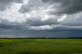 Approaching storm clouds above a canola field, Saskatchewan, Can Royalty Free Stock Photo