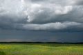 Approaching storm clouds above a canola field, Saskatchewan, Can Royalty Free Stock Photo