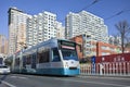 Approaching tram with apartment building on the background, Dalian, China