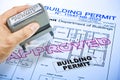 Approved Buildings Permit concept with approved residential building project and plastic stamp Royalty Free Stock Photo
