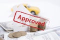Approved mortgage loan agreement application with car, house