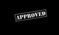 approved rubber stamp on a black background white