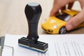 Approved rubber stamp and car model toy with loan application on Royalty Free Stock Photo