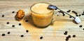appuccino with grains of coffee on a wooden table Royalty Free Stock Photo