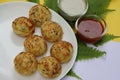 Appum or Appe, Appam or Mixed dal or Rava Appe served with green and red chutney. A Ball shape popular south Indian breakfast dish