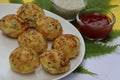 Appum or Appe, Appam or Mixed dal or Rava Appe served with green and red chutney. A Ball shape popular south Indian breakfast dish