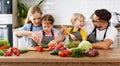 Appy family with child preparing vegetable salad Royalty Free Stock Photo