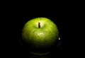 Fresh green apple with water droplets isolated on black background Royalty Free Stock Photo