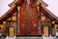 Golden Buddism Mural art and mosaic wall at Wat Xieng thong, Luang Prabang - Laos