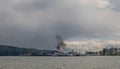 Apr 18, 2023 - Nanaimo, Canada: A puff of black smoke exits the exhaust pipe of a large BC Ferries ship docked at Royalty Free Stock Photo