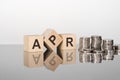 APR - the text is made up of letters on wooden cubes lying on a mirror surface Royalty Free Stock Photo