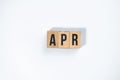 ` APR ` text made of wooden cube on White background