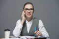 A businesswoman in eyeglasses making a call Royalty Free Stock Photo