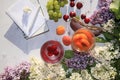 Apricot and cherry juice, apricots, cherries and grapes on a sunny table next to a notebook and copy space, top view. Royalty Free Stock Photo